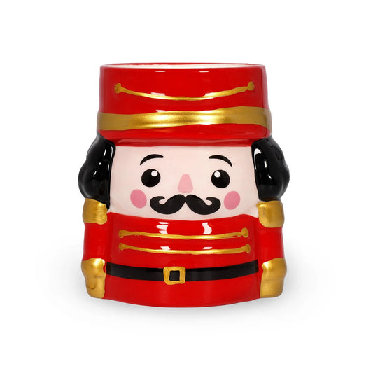 Vela aromática Legami Nutcracker em recipiente decorativo Quebra-Nozes vermelho com detalhes dourados, vista frontal.